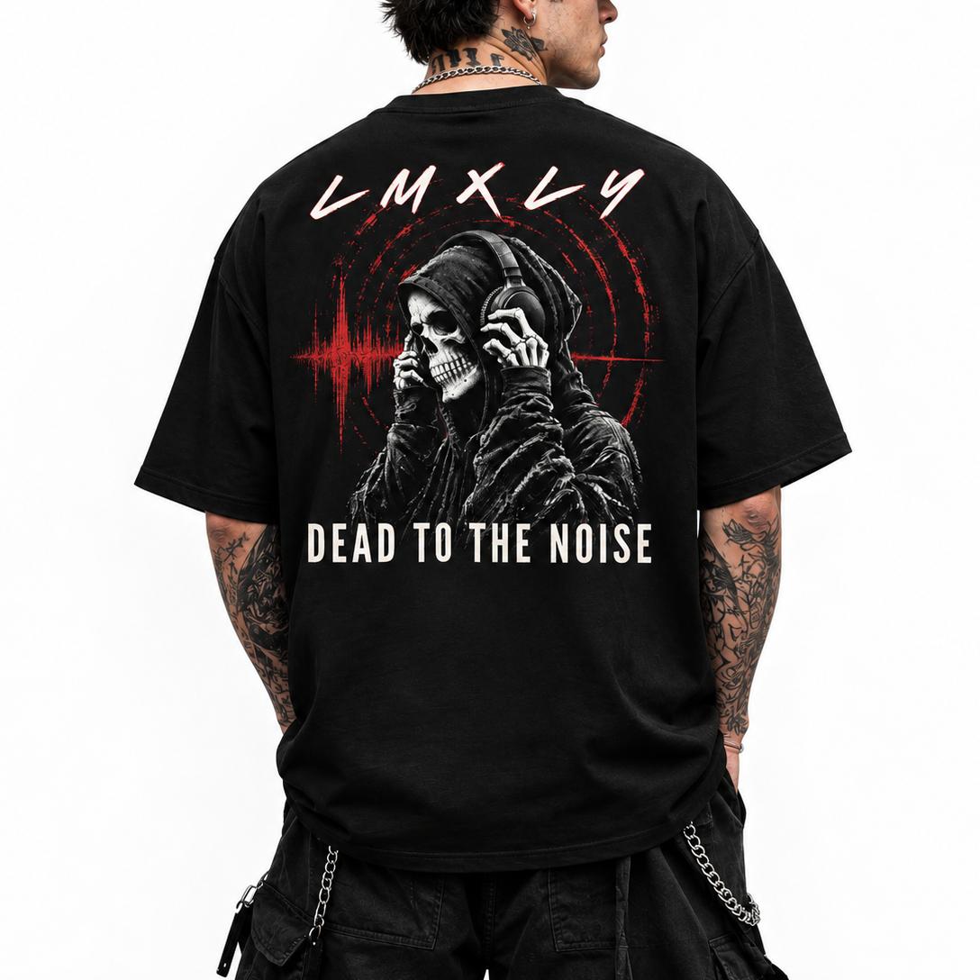 A man wearing a black graphic t-shirt from the back, featuring a skull wearing headphones, a red soundwave, and the text 'LMX-LY' and 'DEAD TO THE NOISE'.